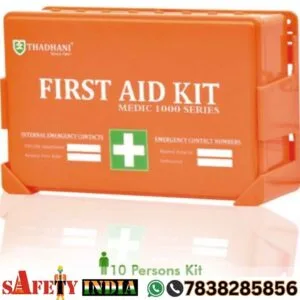Thadhani Medic 1000 Series First Aid Kit for 10 Persons, featuring a high-visibility orange case with a semi-transparent cover, wall mount bracket, and a content list including wound cleaning antiseptic wipes, gauze pads, CPR mask, and burn gel, compliant with ANSI/OSHA Z308.1-2015 standards.